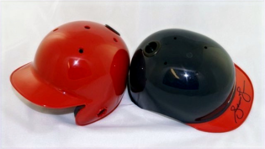 Red and black Showball mini batting helmets with eyepieces set into the shell