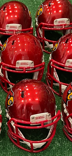 A customer order of red Cardinals Showball mini helmets lined up before shipping